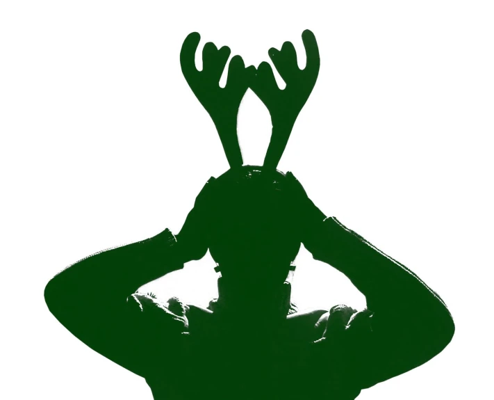 silhouette po of a man with deer antlers on his head