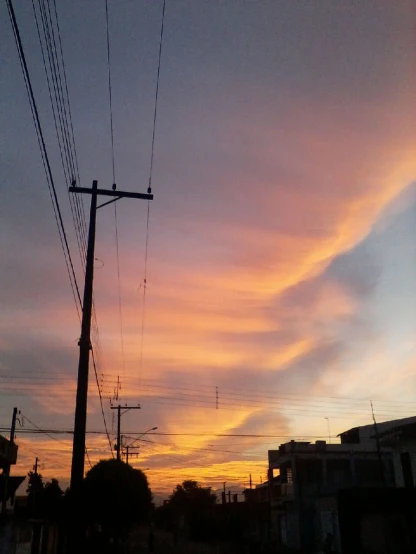 a street scene with telephone poles in the sky