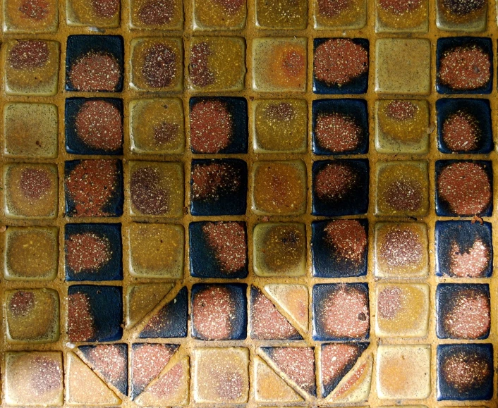 a brick mosaic design in yellow and orange colors