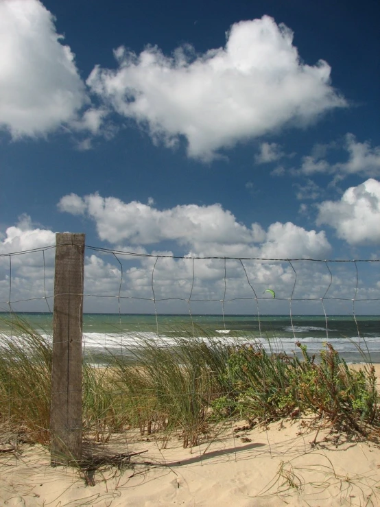 a view of the beach from the dunes