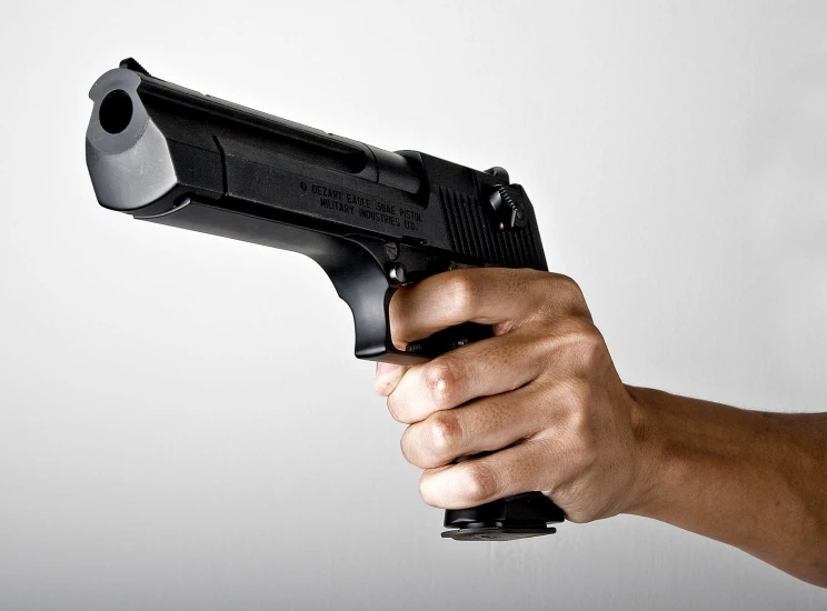 a person holding a gun in their hand