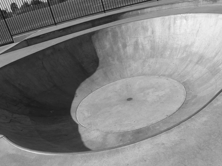 the boy is practicing his tricks in the skateboarding park