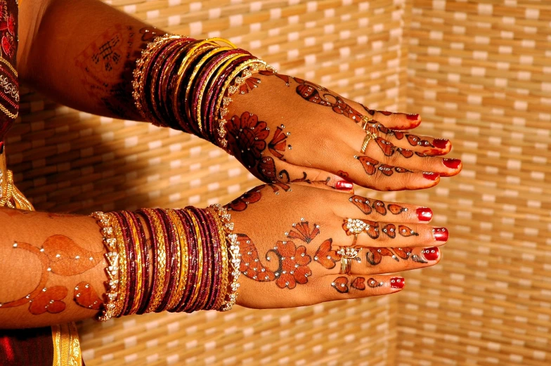 indian girl with various body art on her hands