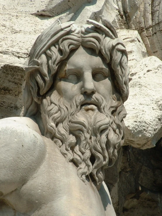 a stone statue with a beard and a beard is shown