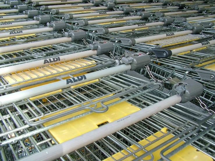 multiple lines of yellow and silver wire for shopping carts