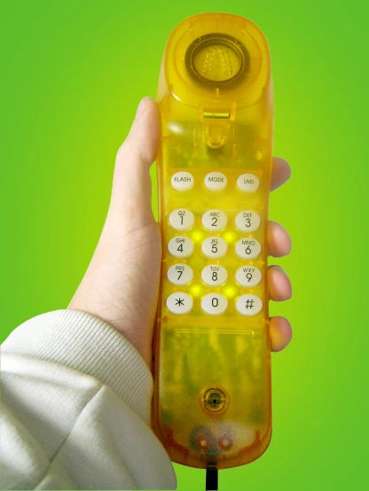 a yellow cell phone being held up by a persons hand