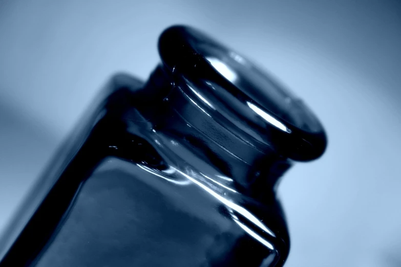 a glass bottle that has a liquid inside