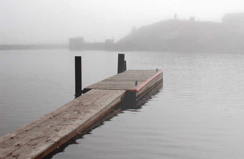 a dock sits at the end of a body of water