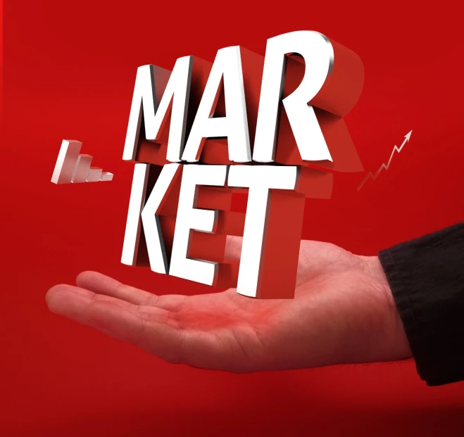 a hand holds out the word mar ket over a red background