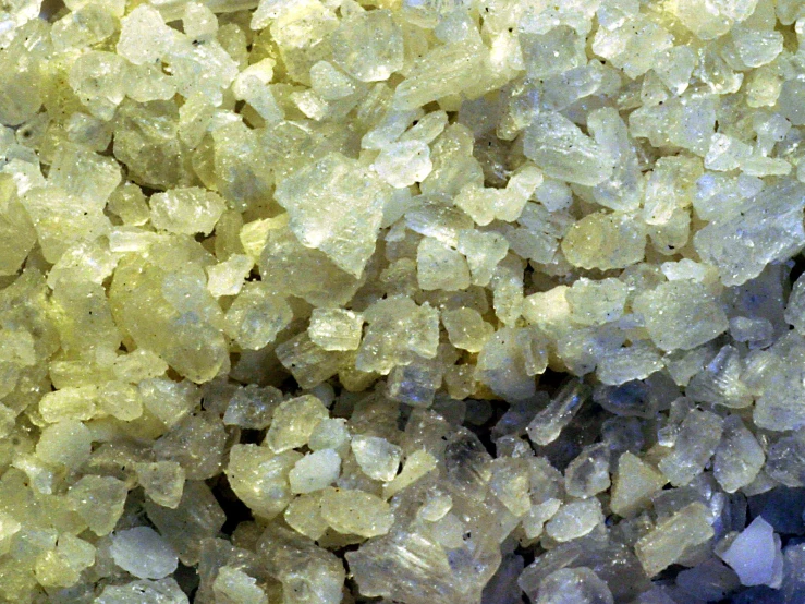 a close up view of rocks made from yellow fluffed mineral