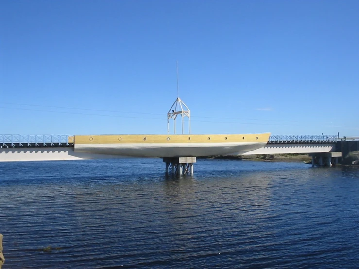 large bridge over water with a man walking