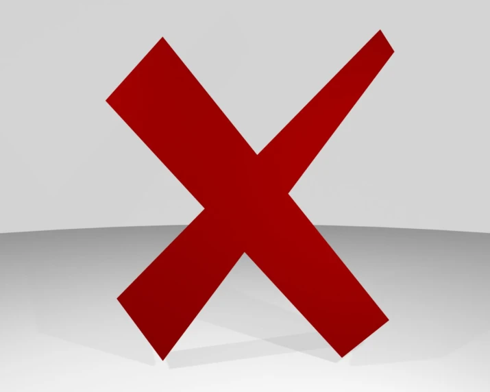 a red x symbol is on a light gray surface