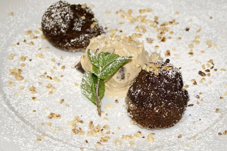 three desserts sit on top of a white plate