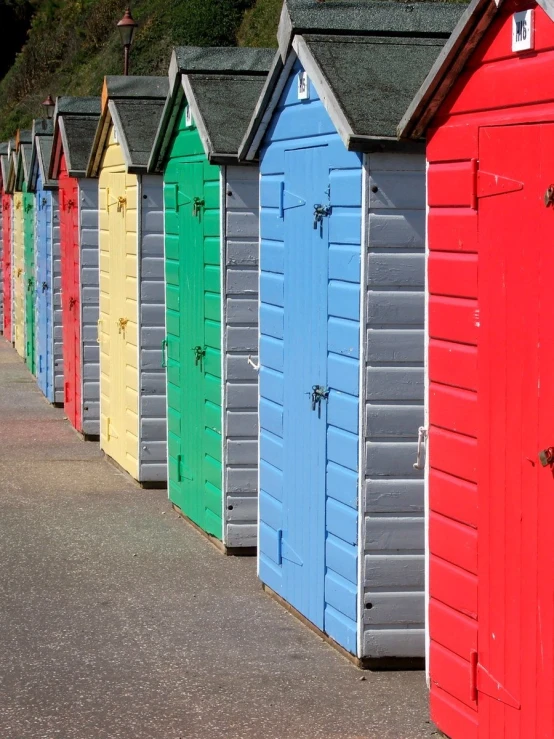 colorful beach huts lined up next to each other