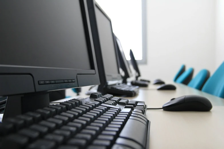 a view of a table that has some computer equipment on it