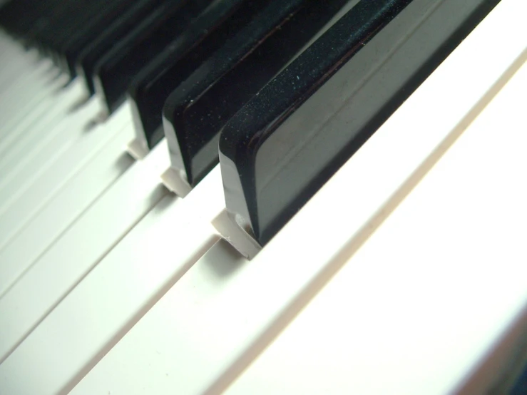 a close up view of a black and white piano