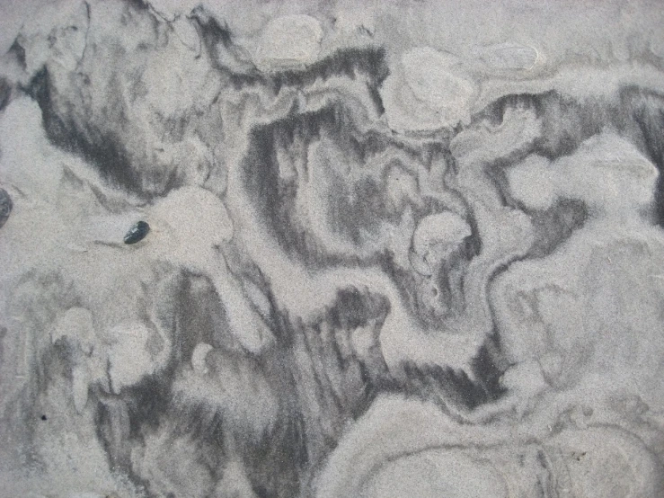 the abstract image shows grey rocks in a rough, grungy background