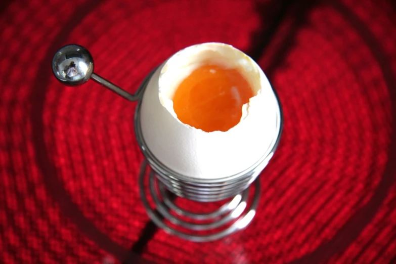 an egg with two eggshells in it on a table