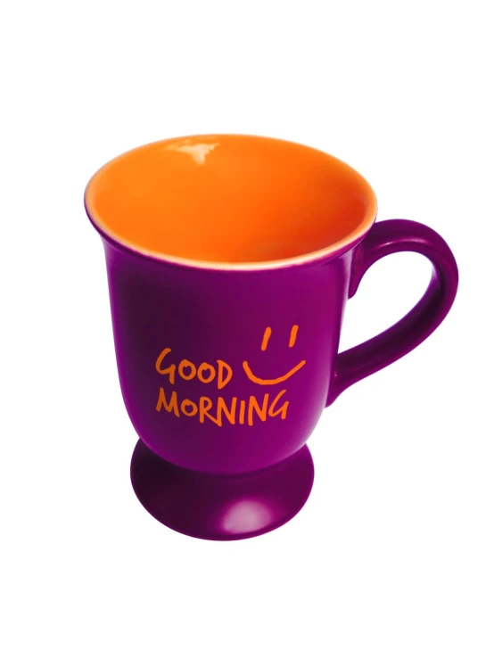an orange and purple cup with the word good morning written in it