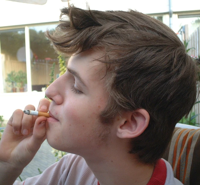 a man with an electronic cigarette in his mouth