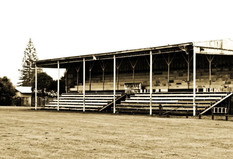 an old, abandoned stadium with several stands and stairs