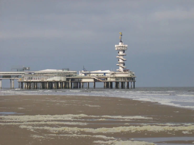 a tower sits on top of the beach