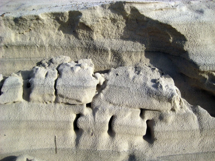 footprints on the sand making for an interesting shape