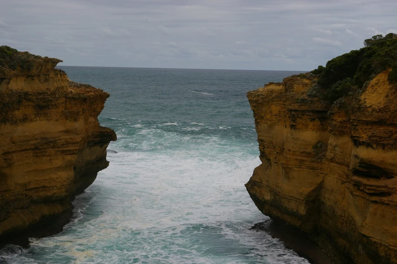 there are two cliff sides by the ocean