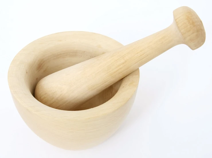 an odd shaped wooden mortar and pestle sit on a white background