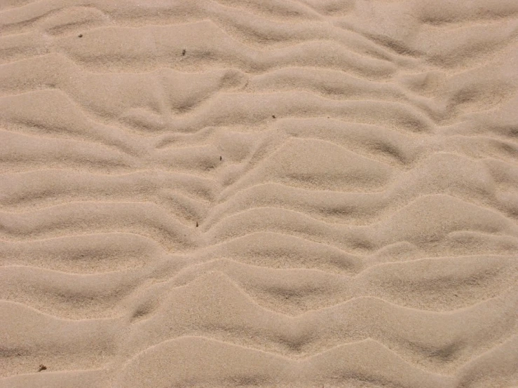 a bunch of sand is shown at the beach