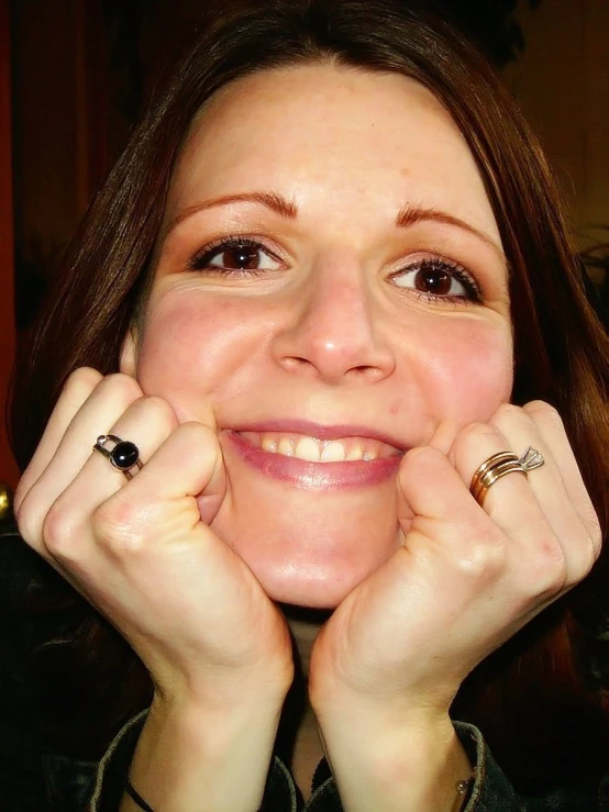 a lady posing for a po with her ring on her hand