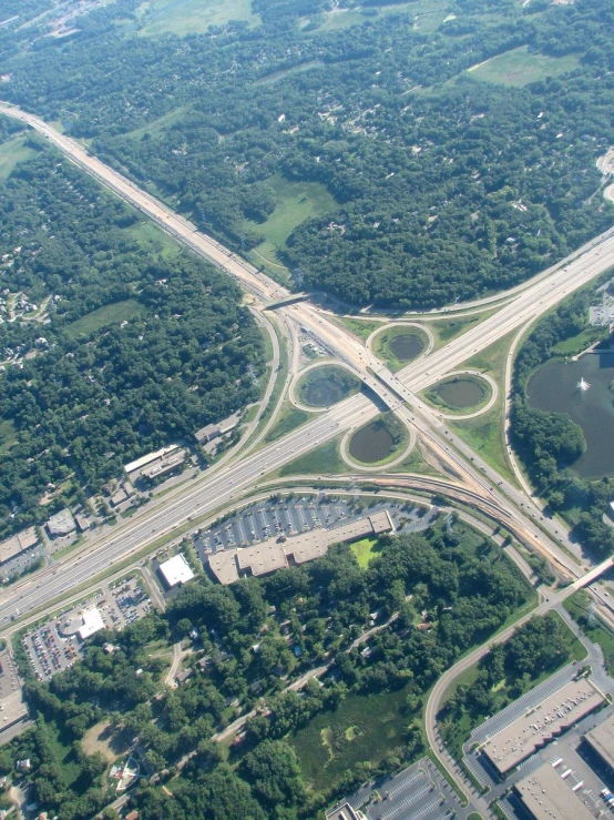 an aerial view of a freeway intersection with many roads