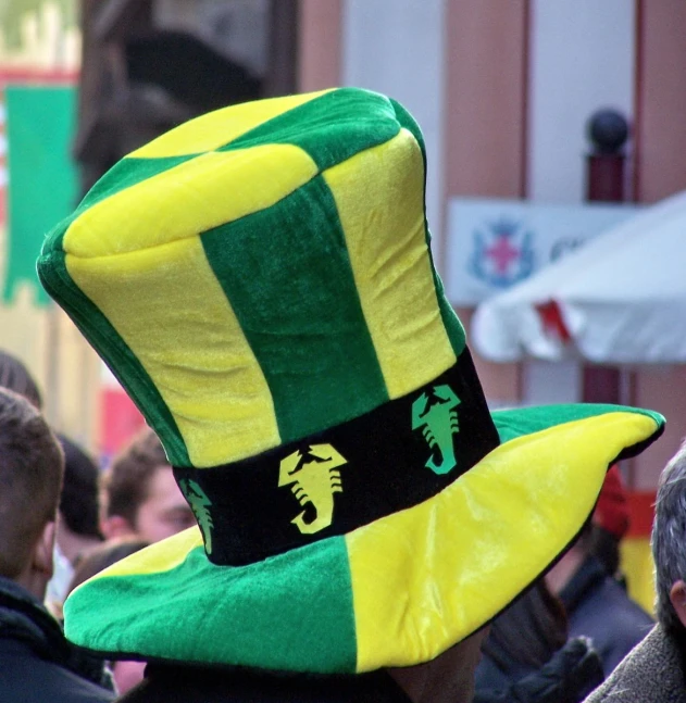 a man wearing a funny green and yellow hat