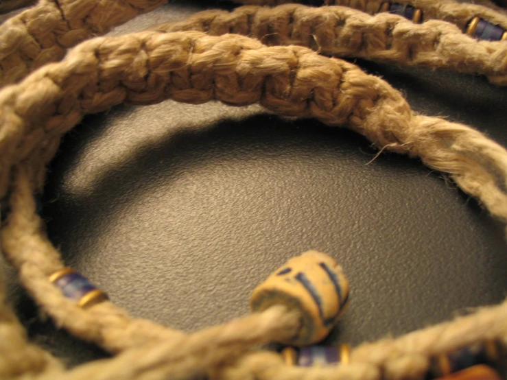 a couple of ropes next to a small object