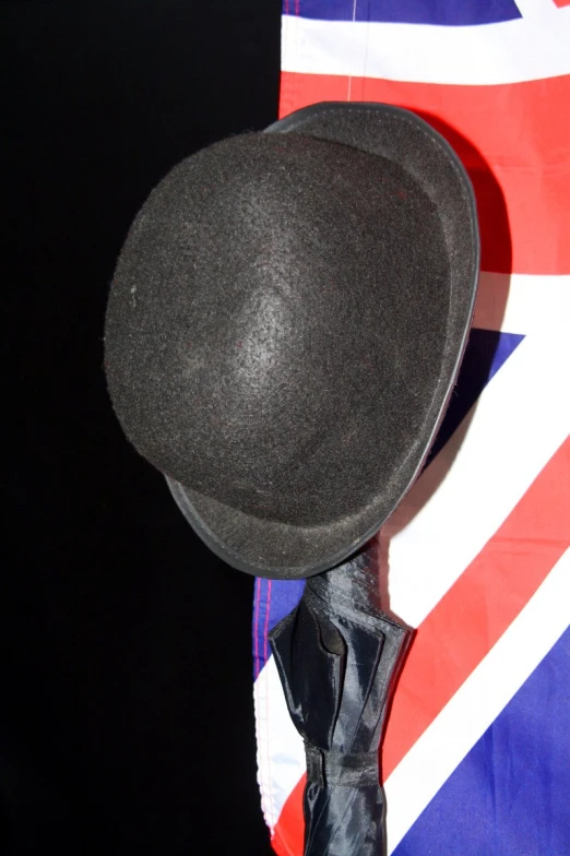 black hat sits on top of a flag