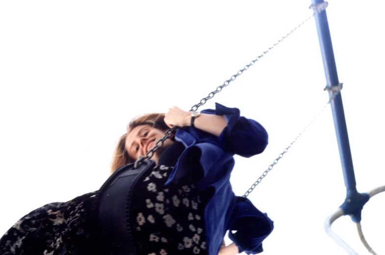 woman on the swings in a carnival park