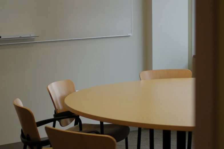 a table in a room with several chairs