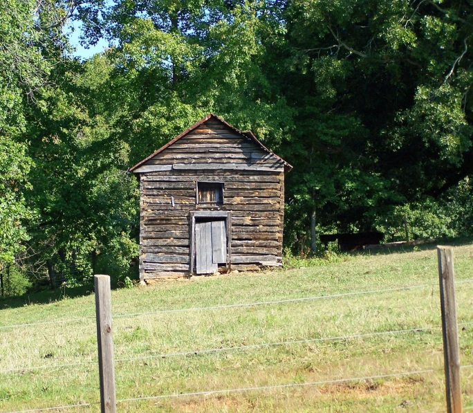 an old cabin is set up in the woods