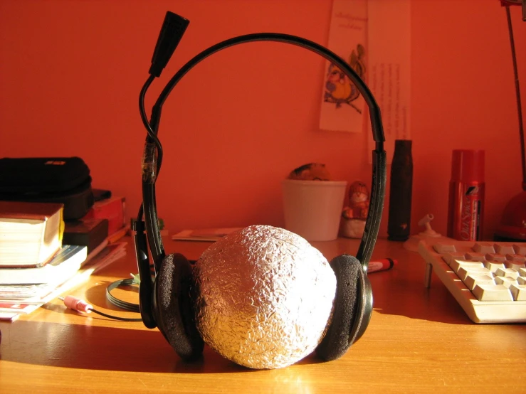 an ear muffs are shown next to a computer keyboard