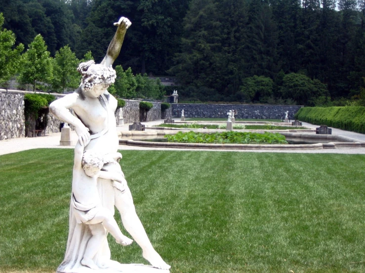 a statue of a baseball player holding a bat