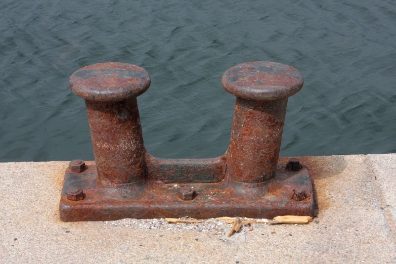 rusted old iron ckets on a concrete pier