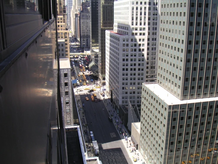 a city street in the middle of some big buildings