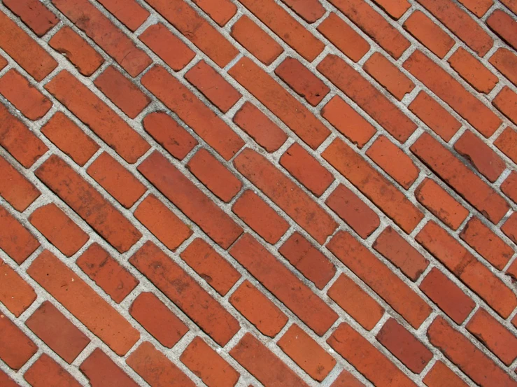 an old brick wall has a stop sign in it