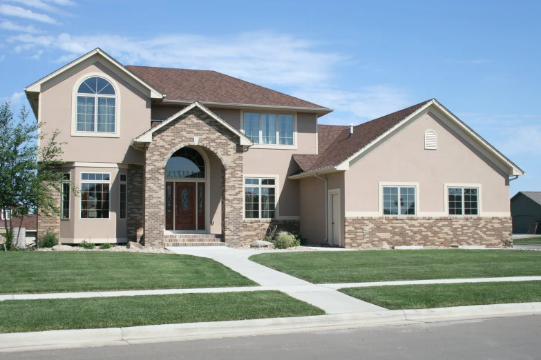 a house with multiple windows and a door on the side