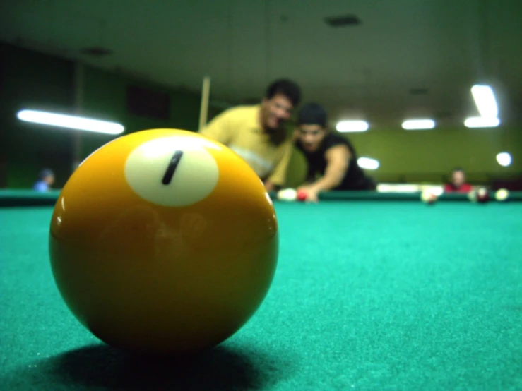 a man and a woman looking at a billiard