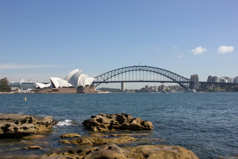 a po taken of the sydney opera opera with the bridge in the background