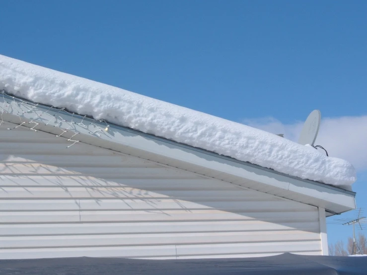 a snowboard propped up against the roof of a house