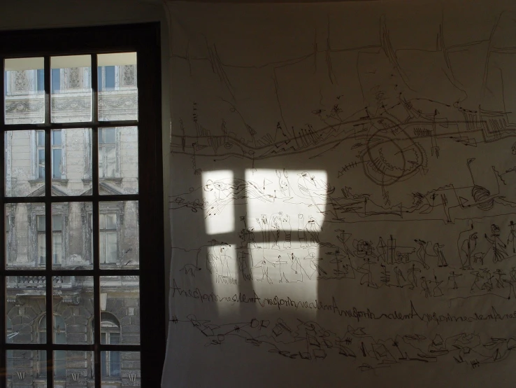 a drawing by two windows with the sun shining into the room