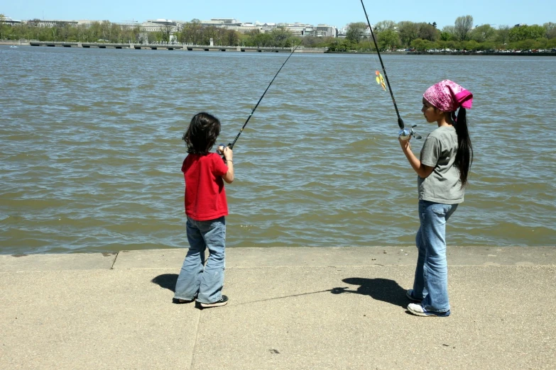 a couple of s on a beach fishing