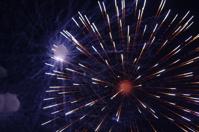 fireworks is glowing in the dark night sky